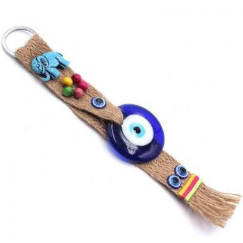 Pieza Decorativa de Vidrio Azulado con Ojos y Elemento Étnico