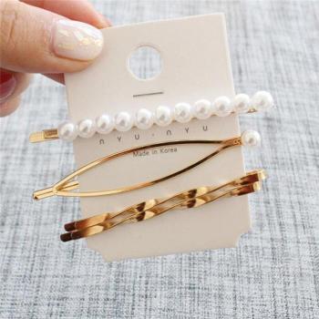Pinzas de pelo elegantes con perlas