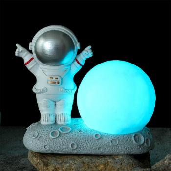 Support de bureau pour smartphone en forme d'astronaute