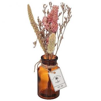 Arreglo de flores secas en bota de cristal