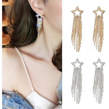 Boucles d'oreilles pendantes en or avec motif étoile et franges