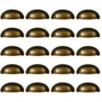 Lote de 20 tiradores de zamak, 64mm, acabado bronce