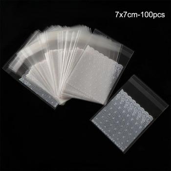 Paquete compacto de 100 bolsas de encaje blanco autoadhesivo para pasteles