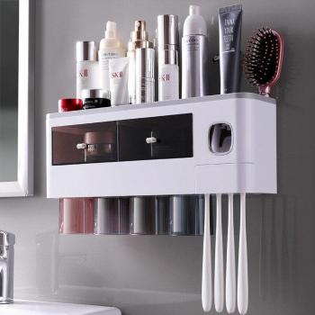Distributeur automatique de dentifrice et porte-brosse mural