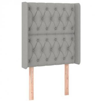 Cabecero tapizado en tela gris claro con dimensiones 83x16x118/128 cm