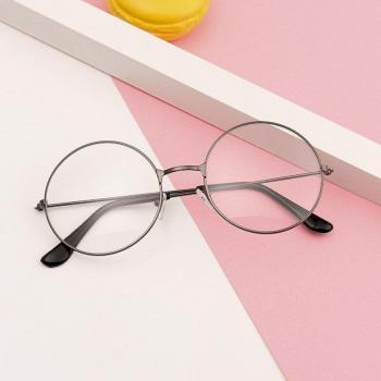 Gafas redondas de metal con lentes transparentes