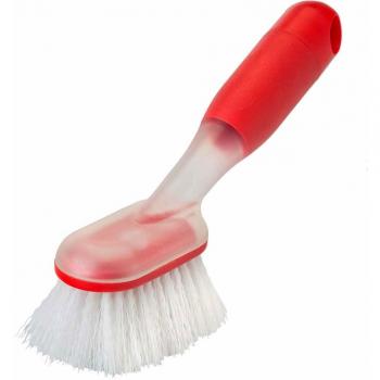 Brosse pour textiles avec réservoir intégré