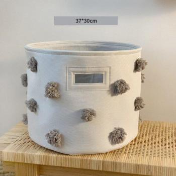 Coffre à linge pliable en toile blanche