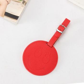 Accessoire de voyage en cuir avec visage joyeux