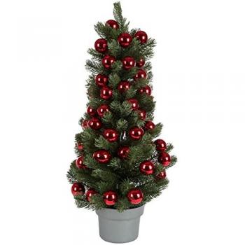 Künstlicher Christbaum im Topf mit roten Kugeln