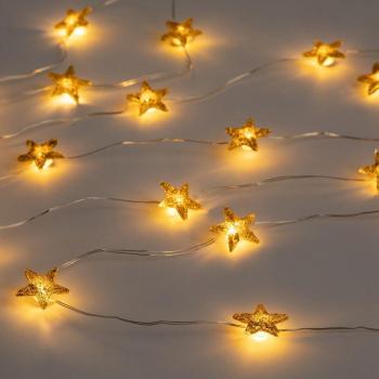 Guirnalda decorativa de estrellas doradas con iluminación LED