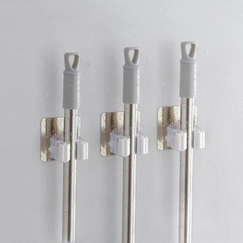 Self-Sticking Mop and Broom Storage Rack