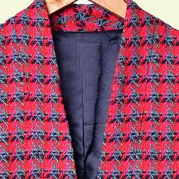 Blazer corto de mujer en tweed, con botones y cuello de pico